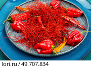 Spicy seasoning, spice, cut from red pepper. Thinly sliced pepper.. Hot red pepper spice. Стоковое фото, агентство Ingram Publishing / Фотобанк Лори