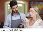 a young woman tasting wine. Стоковое фото, агентство Ingram Publishing / Фотобанк Лори