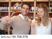 couple tasting a glass of  wine in traditional cellar. Стоковое фото, агентство Ingram Publishing / Фотобанк Лори