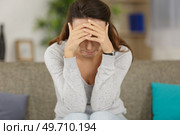 depressed woman on the sofa. Стоковое фото, агентство Ingram Publishing / Фотобанк Лори