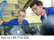 young qualified people forced to work at the factory. Стоковое фото, агентство Ingram Publishing / Фотобанк Лори