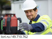 a man is studying construction drawings. Стоковое фото, агентство Ingram Publishing / Фотобанк Лори
