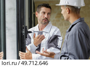 a double glazing door installer. Стоковое фото, агентство Ingram Publishing / Фотобанк Лори