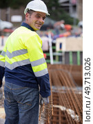 builder worker in safety protective equipment at construction site. Стоковое фото, агентство Ingram Publishing / Фотобанк Лори