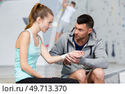instructor caring for climbers injured wrist. Стоковое фото, агентство Ingram Publishing / Фотобанк Лори