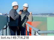 portrait of laborers outside a factory. Стоковое фото, агентство Ingram Publishing / Фотобанк Лори