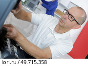 technician specialized in a large printer. Стоковое фото, агентство Ingram Publishing / Фотобанк Лори