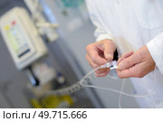 close up of doctor preparing iv. Стоковое фото, агентство Ingram Publishing / Фотобанк Лори