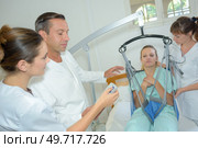 the interns during physical therapy. Стоковое фото, агентство Ingram Publishing / Фотобанк Лори