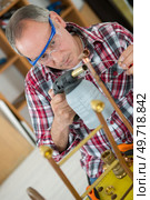 plumber working with a blow torch. Стоковое фото, агентство Ingram Publishing / Фотобанк Лори