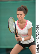 female tennis player in a receiving service stance. Стоковое фото, агентство Ingram Publishing / Фотобанк Лори