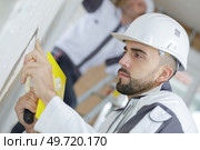 portrait of male plasterer at work. Стоковое фото, агентство Ingram Publishing / Фотобанк Лори