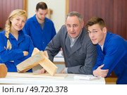 portrait of trainee looking in studio. Стоковое фото, агентство Ingram Publishing / Фотобанк Лори