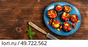 Mushroom, champignons caps roasted stuffed with bell pepper. Homemade baked stuffed mushrooms, space for text. Plate with stuffed mushrooms. Стоковое фото, агентство Ingram Publishing / Фотобанк Лори