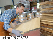 wood barrels production cooper using hammer and tools in workshop. Стоковое фото, агентство Ingram Publishing / Фотобанк Лори