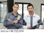 a portrait of two workmen. Стоковое фото, агентство Ingram Publishing / Фотобанк Лори