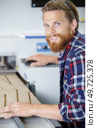 young man working in carpenting studio. Стоковое фото, агентство Ingram Publishing / Фотобанк Лори