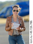 a female pilot with helicopter. Стоковое фото, агентство Ingram Publishing / Фотобанк Лори