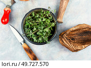 Marjoram, a hot spice with a sweet smell, medicinal plant. Origanum majorana. Fresh marjoram leaves on the table. Стоковое фото, агентство Ingram Publishing / Фотобанк Лори