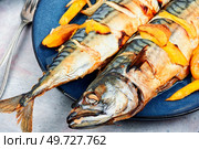 Appetizing mackerel fish roasted with mango. Healthy homemade food. Cookbook recipe.. Baked mackerel with mango. Стоковое фото, агентство Ingram Publishing / Фотобанк Лори