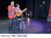 portrait of duo live on stage. Стоковое фото, агентство Ingram Publishing / Фотобанк Лори