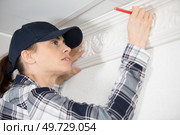 female worker with corner and pencil. Стоковое фото, агентство Ingram Publishing / Фотобанк Лори