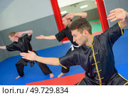 men on martial arts class. Стоковое фото, агентство Ingram Publishing / Фотобанк Лори