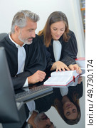they are reading a sentence. Стоковое фото, агентство Ingram Publishing / Фотобанк Лори