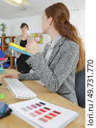 she is working at a renovation agency. Стоковое фото, агентство Ingram Publishing / Фотобанк Лори