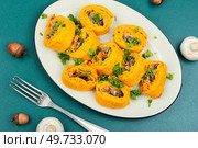 Pumpkin dough rolls or pie stuffed with mushrooms. Autumn traditional food. Loaf of pumpkin bread. Autumn Baking.. Pumpkin rolls with mushrooms. Стоковое фото, агентство Ingram Publishing / Фотобанк Лори