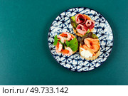 Tartlets or canapes with smoked salmon, shrimp and bacon. Concept of food, restaurant. Space for text.. Tartlets with seafood and bacon, tasty snack. Стоковое фото, агентство Ingram Publishing / Фотобанк Лори