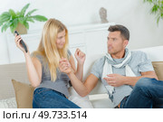 a couple with remote control. Стоковое фото, агентство Ingram Publishing / Фотобанк Лори