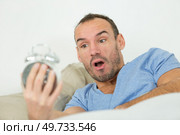young man is stressed and shocked about the time. Стоковое фото, агентство Ingram Publishing / Фотобанк Лори