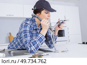 plumber fixing tap with adjustable wrench. Стоковое фото, агентство Ingram Publishing / Фотобанк Лори