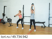 Two women working out in gym studio. Стоковое фото, агентство Ingram Publishing / Фотобанк Лори