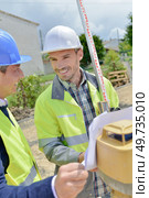 a man and geometers works. Стоковое фото, агентство Ingram Publishing / Фотобанк Лори