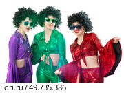 Disco style girls in colorful flared suits and African American wigs on a white background. Seventies or eighties style. Стоковое фото, фотограф Лазаренко Светлана / Фотобанк Лори