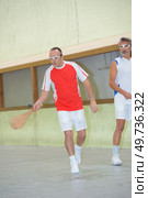 team of men playing pala. Стоковое фото, агентство Ingram Publishing / Фотобанк Лори