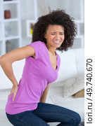 office worker sufffering from back pain. Стоковое фото, агентство Ingram Publishing / Фотобанк Лори