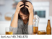sad and wasted alcoholic woman. Стоковое фото, агентство Ingram Publishing / Фотобанк Лори