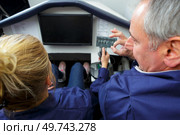 man and female apprentice in aircraft simulator. Стоковое фото, агентство Ingram Publishing / Фотобанк Лори