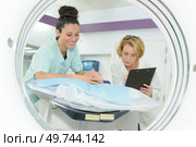 women technologist inspecting the equipment. Стоковое фото, агентство Ingram Publishing / Фотобанк Лори