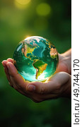 Glass glowing sphere of planet Earth In palms of hands is a ball with internal microclimate, caring for planet, clean environment, protecting ecology, geography, continents, travel. AI generated. Стоковое AI-изображение, AI-художник Ольга Симонова / Фотобанк Лори