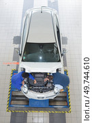 portrait of two professional car mechanics working together. Стоковое фото, агентство Ingram Publishing / Фотобанк Лори