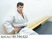 Young man in kimono in changing room. Стоковое фото, агентство Ingram Publishing / Фотобанк Лори