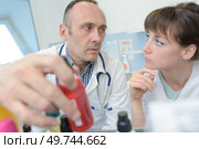 portrait of doctor and nurse at work in hospital. Стоковое фото, агентство Ingram Publishing / Фотобанк Лори