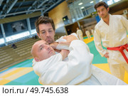portrait of men in judo hold. Стоковое фото, агентство Ingram Publishing / Фотобанк Лори