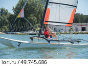 portrait of man sailing catamaran. Стоковое фото, агентство Ingram Publishing / Фотобанк Лори