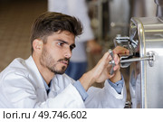 a male sommelier in winery. Стоковое фото, агентство Ingram Publishing / Фотобанк Лори