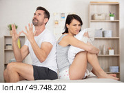 a stressed men tired ears because snoring. Стоковое фото, агентство Ingram Publishing / Фотобанк Лори